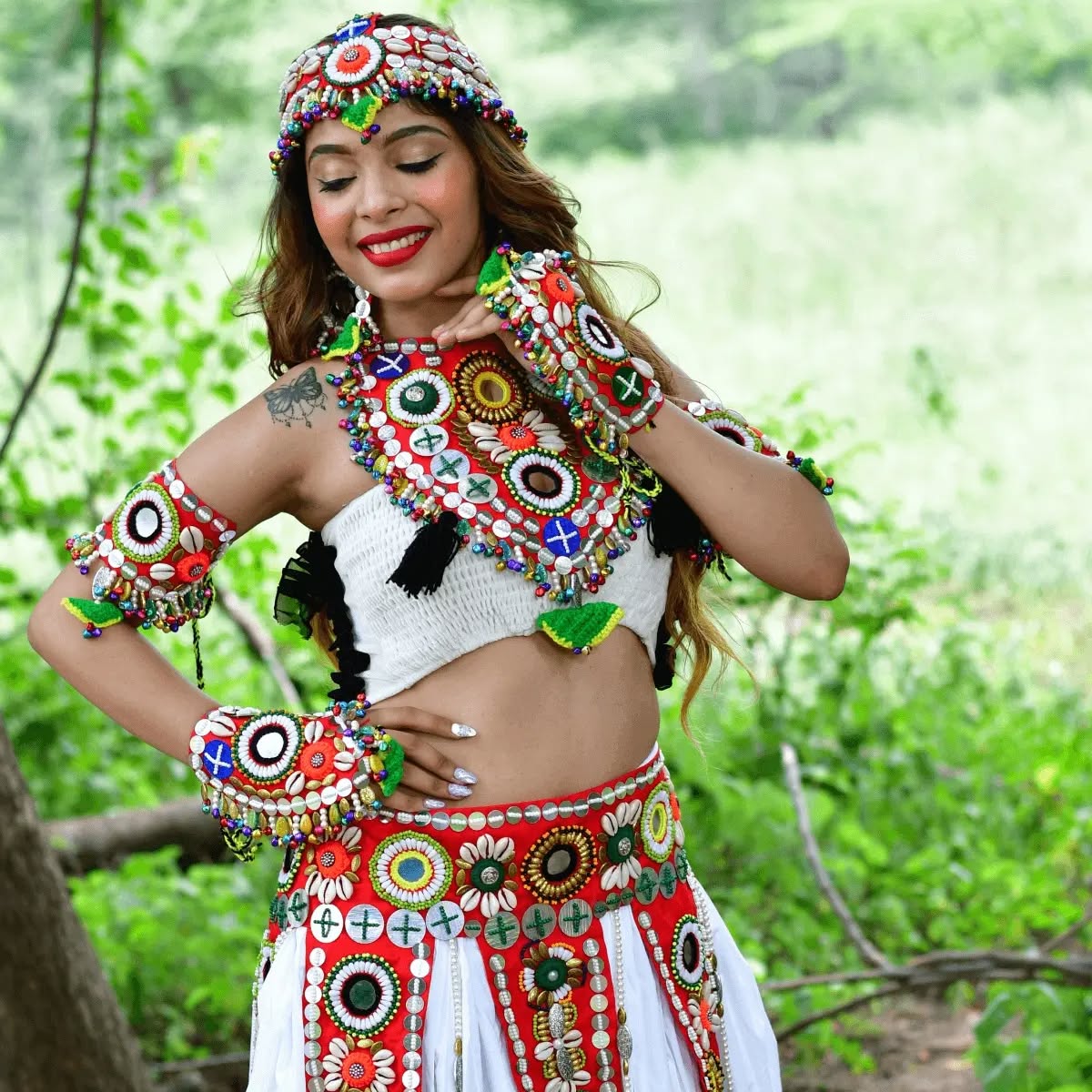 Girl wearing navratri jewelry red set