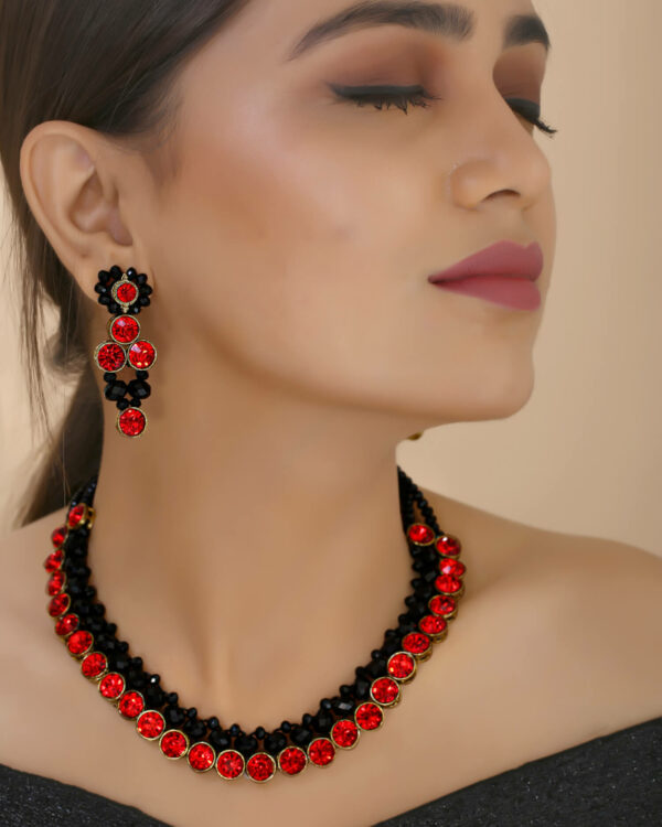 Beautiful girl wearing red and black necklace