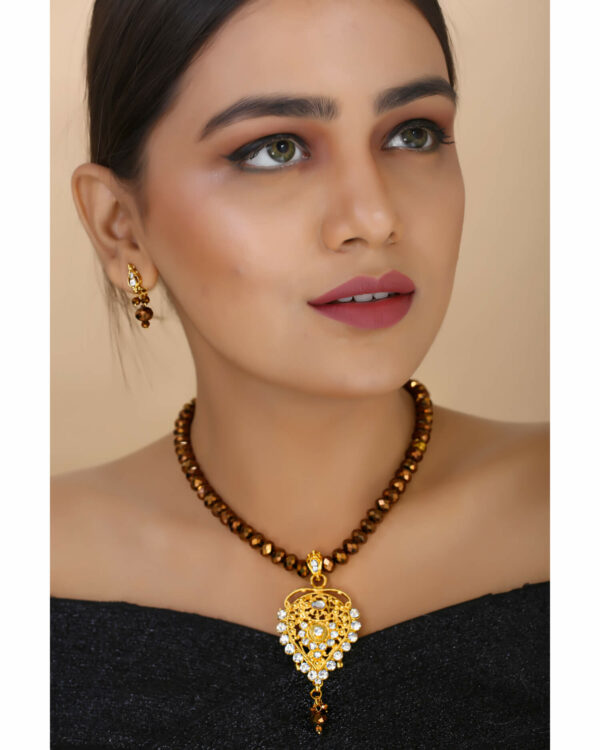 Girl Wearing Brown Crystal Beads Gold Pendant Designer Necklace